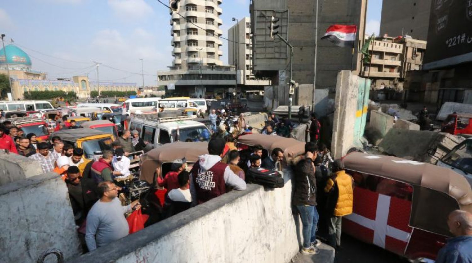 Tahrir Meydanı’ndaki Iraklı protestocular (AFP)