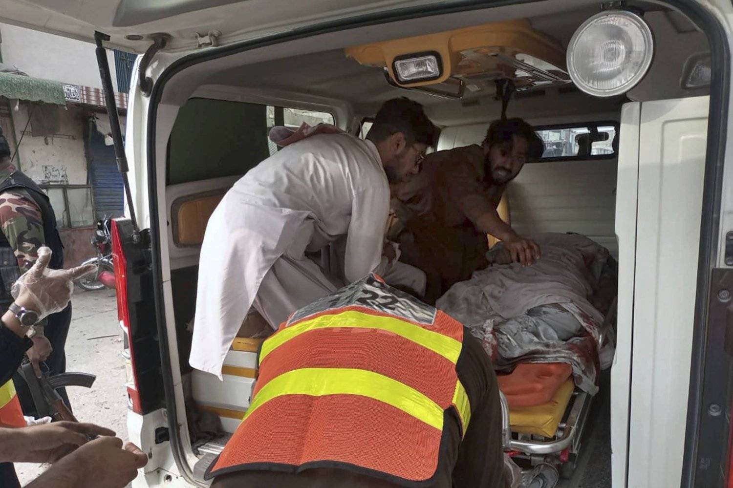 Injured people transferred to an ambulance in Pakistan (AP archive)
