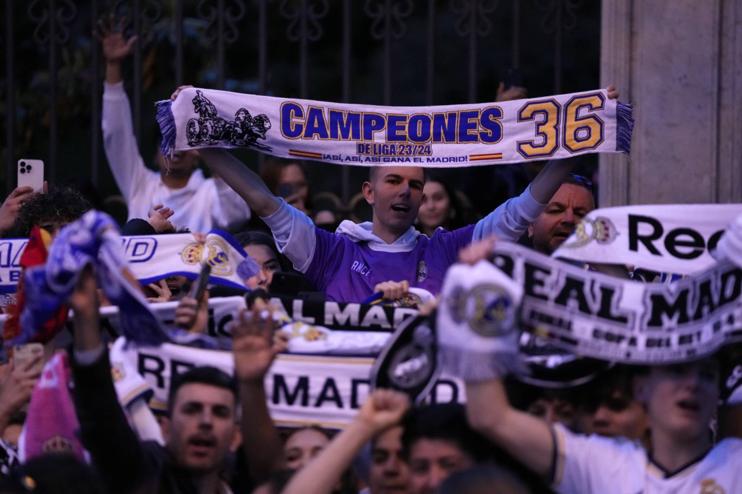 Real Madrid supporters celebrate in Cibeles Square in Madrid after their team clinched the La Liga title, Saturday, May 4, 2024. (AP Photo/Manu Fernandez)