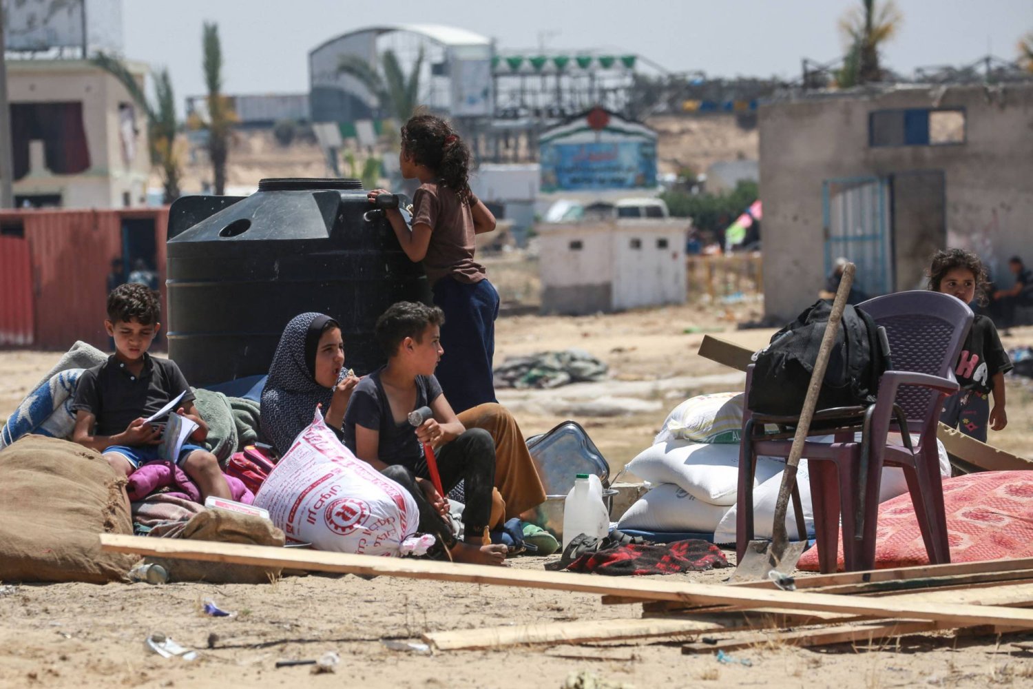 Displaced Palestinians rest as they set up their tent after returning to Khan Yunis in the southern Gaza Strip on May 9, 2024. (Photo by AFP)