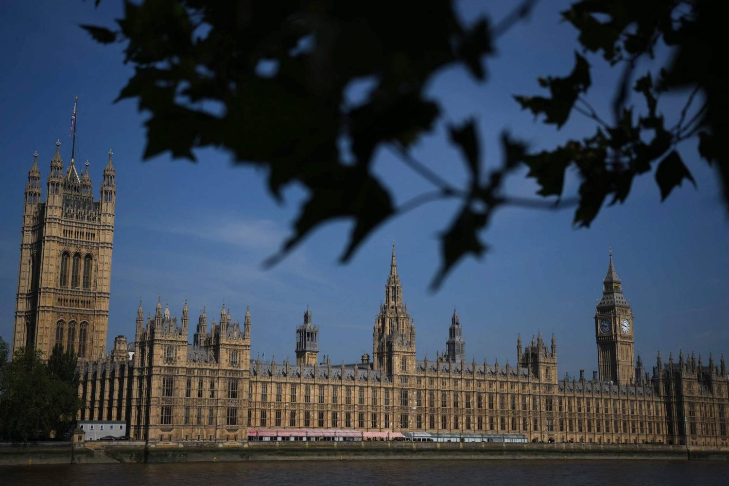 A general view shows Palace of Westminster, home to the Houses of Parliament, and the Elizabeth Tower, commonly known by the name of the bell "Big Ben", in London on June 15, 2023. (Photo by Daniel LEAL / AFP)
