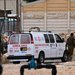 سيارة إسعاف قرب قاعدة جبل حريف العسكرية قرب الحدود مع مصر بعد الحادث الأمني السبت (أ.ف.ب)